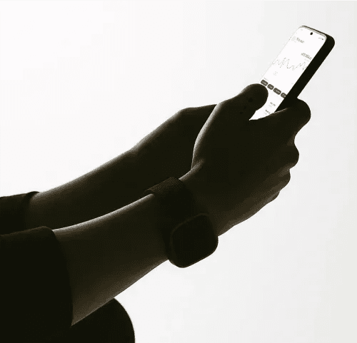Hands holding a phone showing Bitcoin in the Tap app